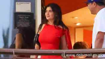 Kylie Jenner wows in curve-clinging red dress as she grabs dinner with her fashionista sister Kendall in LA