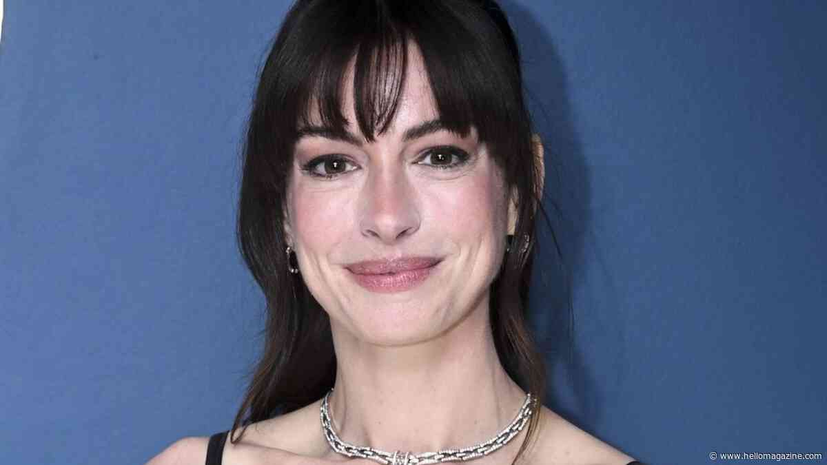 Anne Hathaway is almost unrecognizable with blonde hair and a sheer gown in throwback snap