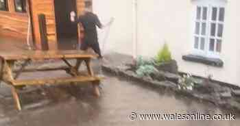 Torrential rain creates 'massive river' causing huge clean up at historic Welsh pub