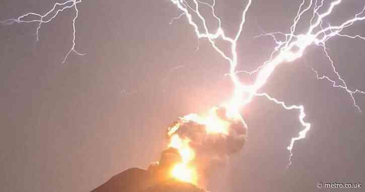 Out-of-this-world moment lightning bolt strikes volcano while it’s erupting