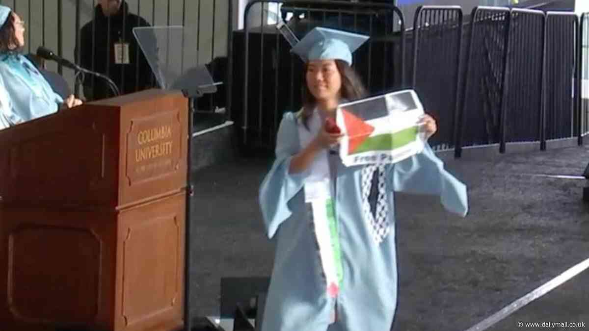 Columbia University students RIP UP diplomas on stage during commencement while wearing zip ties and holding Palestine flags