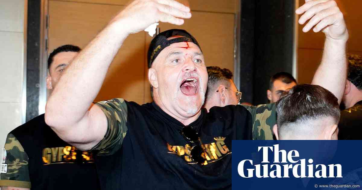 John Fury left bloodied after butting member of Usyk's team – video