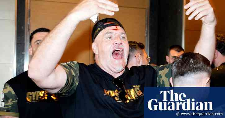John Fury left bloodied after butting member of Usyk's team – video