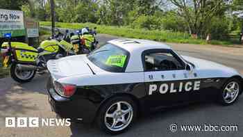 Motorcycle patrol pulls over Japanese 'police' car