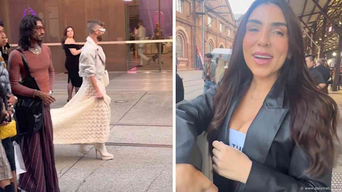 Jamie Azzopardi: Influencer's cringeworthy Australian Fashion Week arrival as they get three 'minders' to carry the train of their OTT dress into the event: 'It is not the MET gala'
