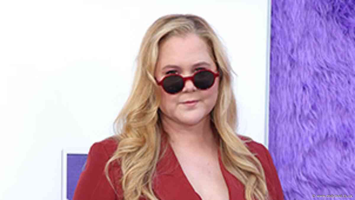 Amy Schumer puts on a stylish display in muted monochromatic red suit at star-studded premiere of family comedy IF in New York City