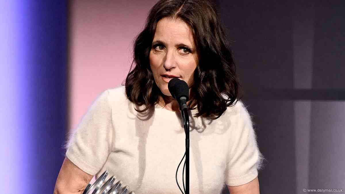 Julia Louis-Dreyfus looks chic in a black-and-white look as she accepts a Webby Award for Podcast of the Year for Wiser Than Me