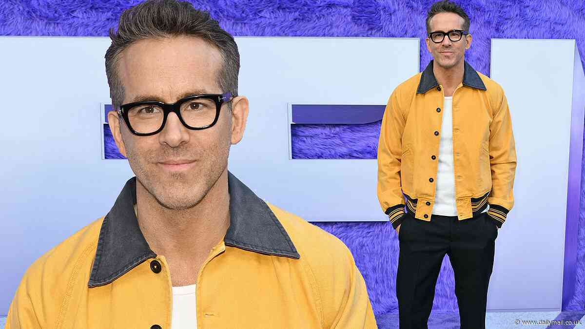 Ryan Reynolds cuts a smart figure in glasses and golden yellow bomber at IF premiere in NYC