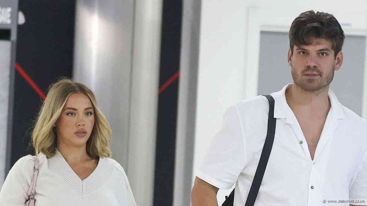 No split here! Tammy Hembrow and fiancé Matt Zukowski arrive hand-in-hand at Sydney Airport after breakup rumours