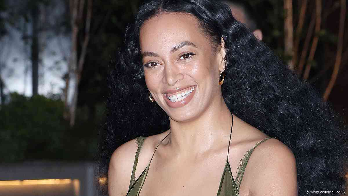 Solange Knowles puts on a VERY racy display in sheer khaki bra top as she attends Gucci show at the Tate Modern