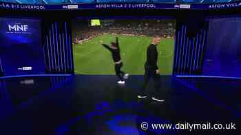 Gary Neville shows his true Man United colours as his emphatic celebration following Aston Villa's late equaliser against Liverpool - in front of despondent Jamie Carragher - is caught by MNF cameras