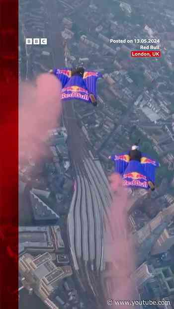 Skydivers complete wingsuit flight through London's Tower Bridge in world first. #Skydiving #BBCNews