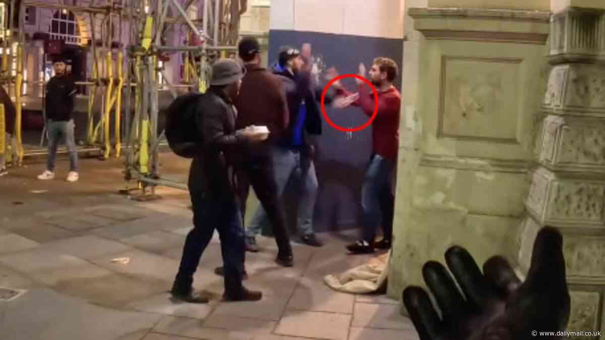 Shocking moment thug brazenly yanks chain off man's neck in London Piccadilly Circus before violent brawl breaks out in the road (and he nearly loses his phone too)