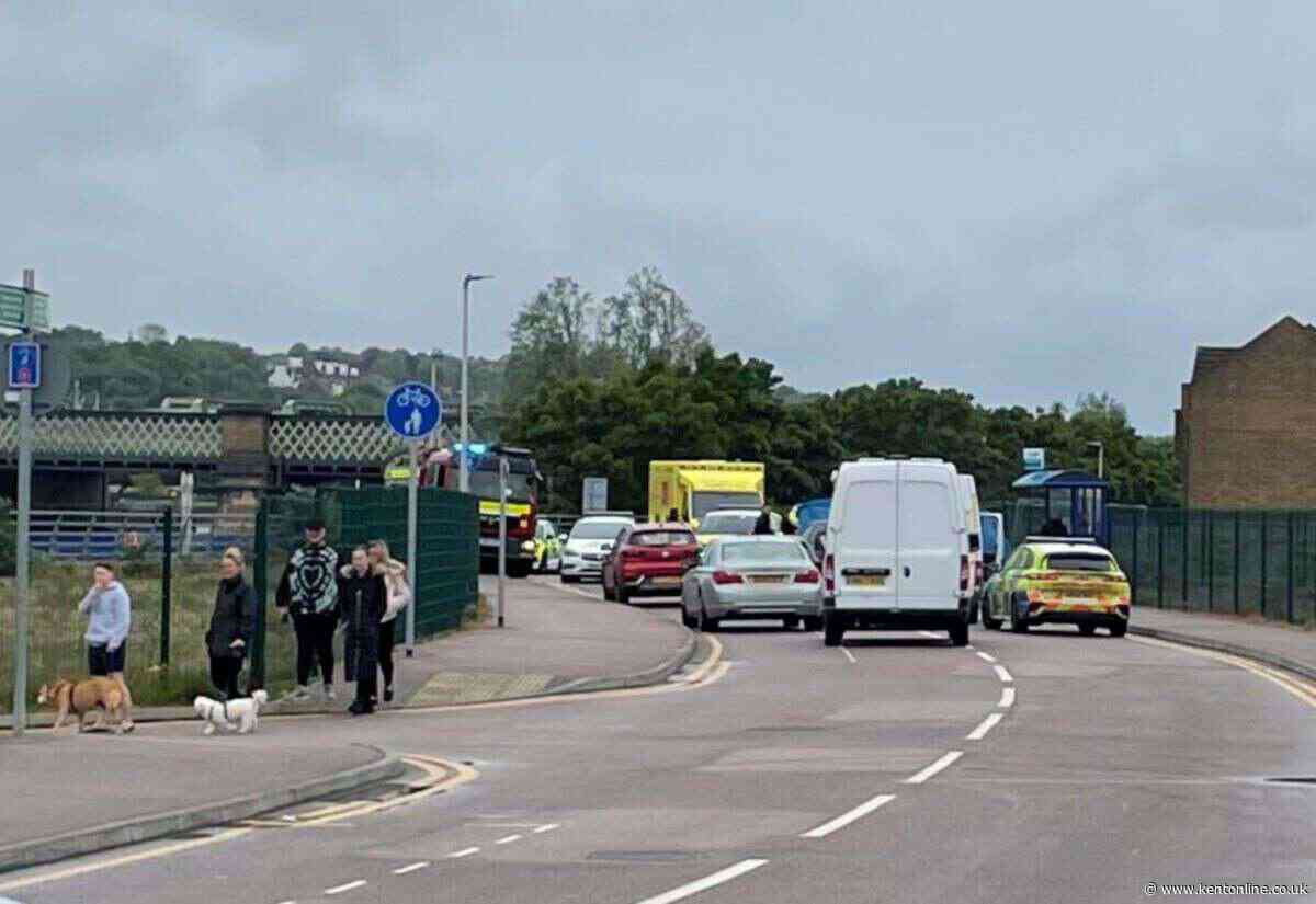 Road taped off after car and motorbike crash