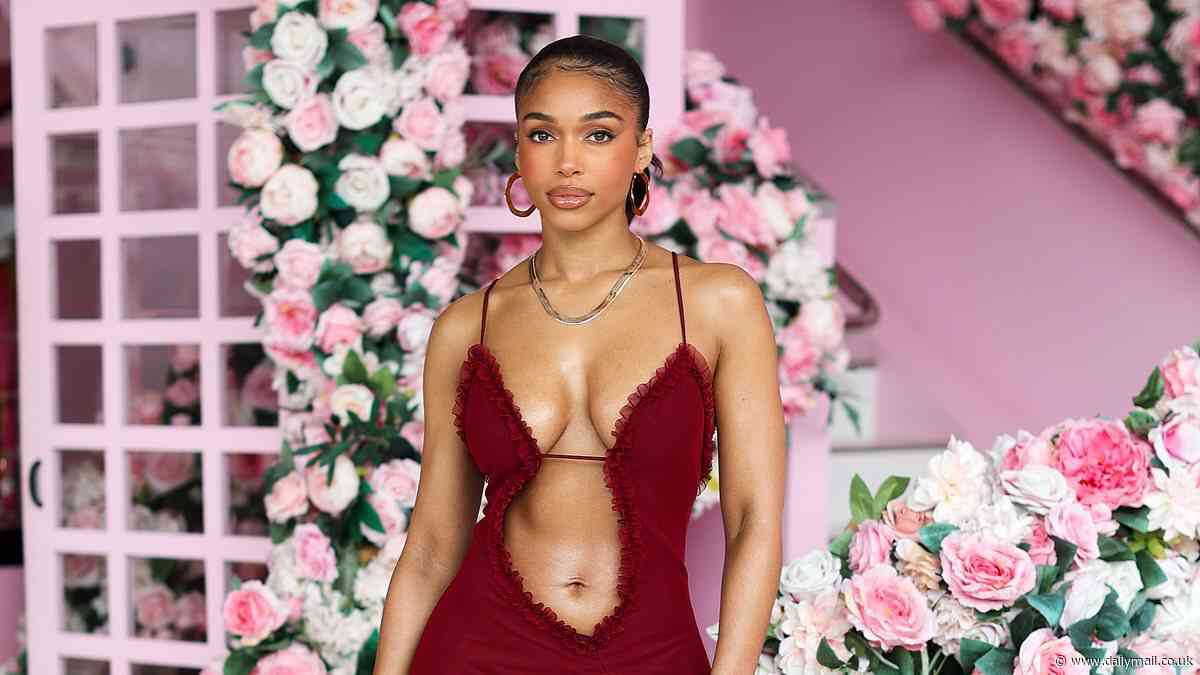 Lori Harvey flashes the flesh in a blood-red sheer mini dress as she shops in Los Angeles... after dad Steve Harvey talked her love life