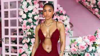 Lori Harvey flashes the flesh in a blood-red sheer mini dress as she shops in Los Angeles... after dad Steve Harvey talked her love life