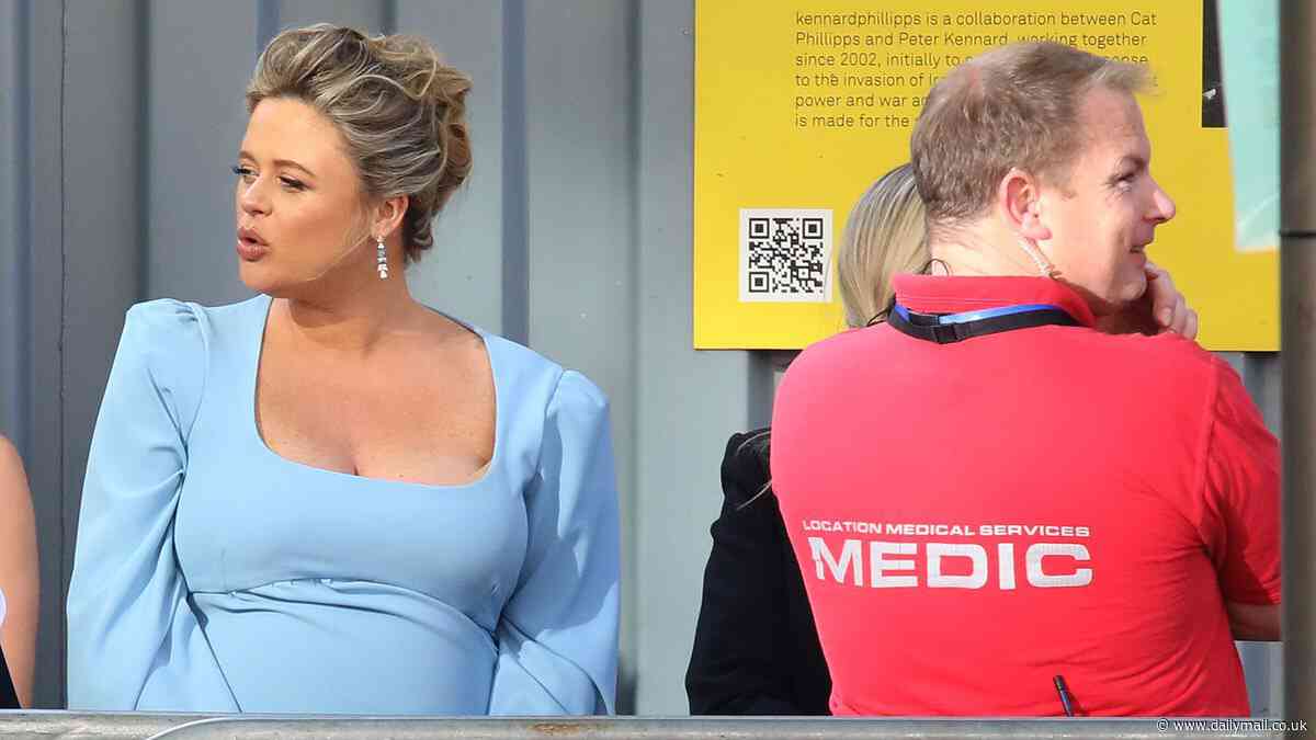 Pregnant Emily Atack is helped by a medic at the BAFTA Television Awards as she's escorted to her car in scorching heatwave