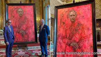 King Charles reacts as he unveils his first official portrait since coronation