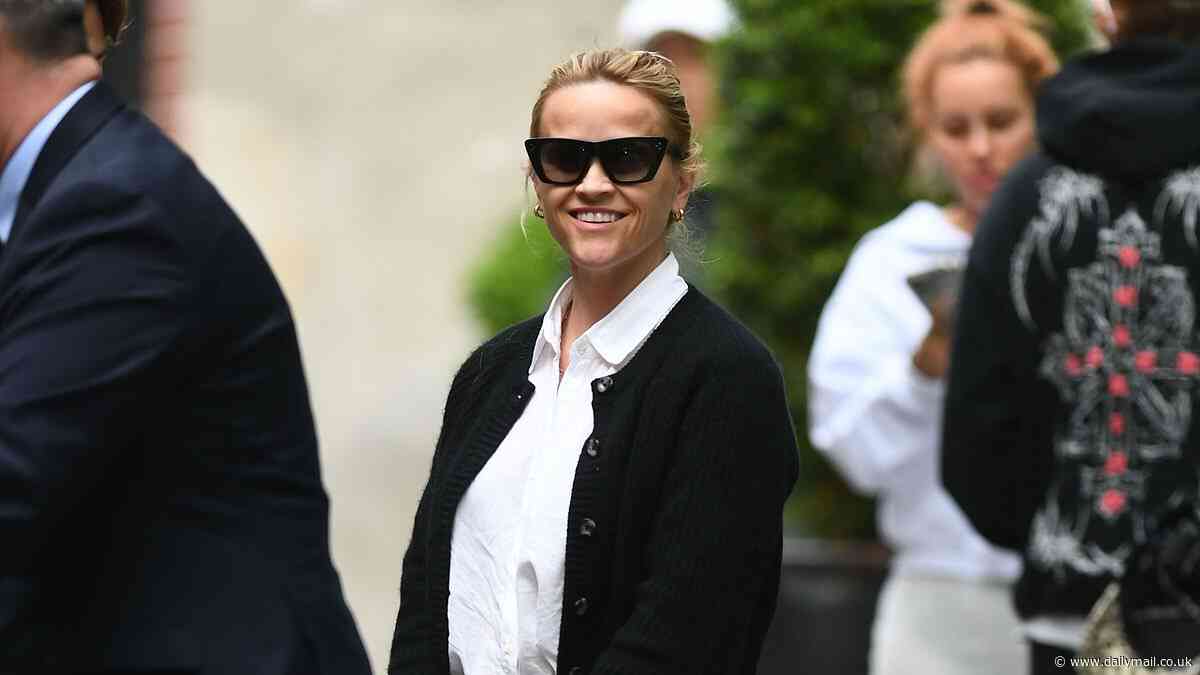 Reese Witherspoon, 48, is seen getting a hug from her son Deacon, 20, in NYC... as the teaser for her Will Ferrell comedy You're Cordially Invited drops
