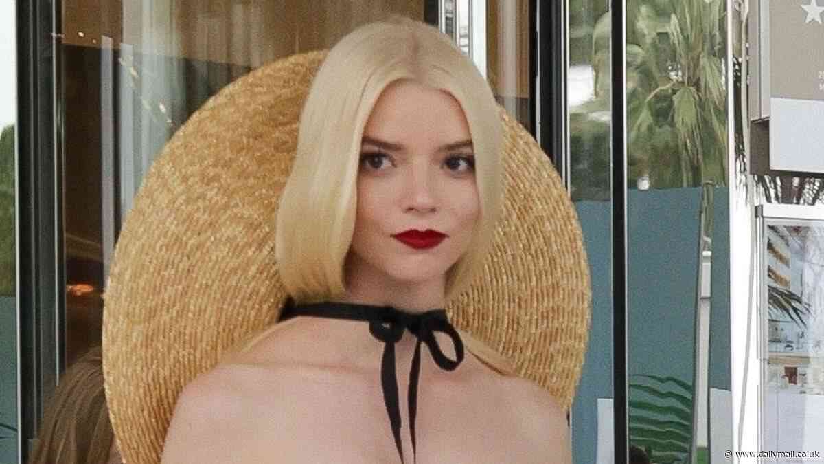 Anya Taylor-Joy puts on a racy display in a semi-sheer white strapless dress and sunhat at the Cannes Film Festival