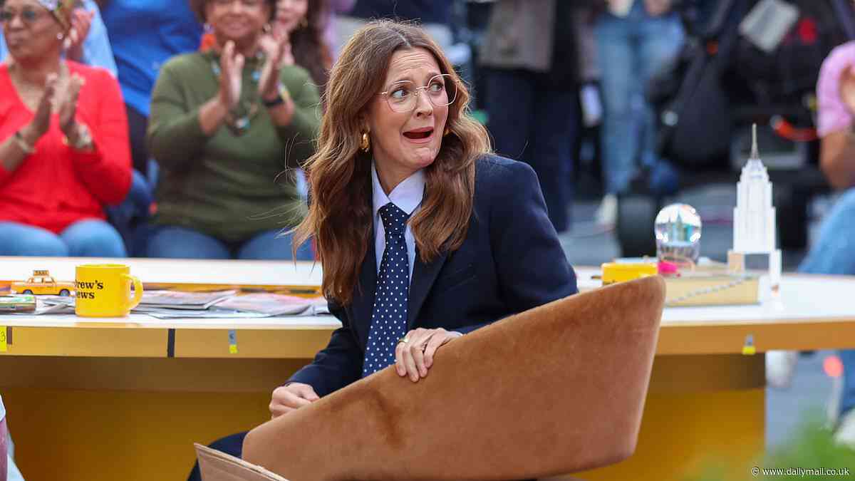 Drew Barrymore FALLS out of her chair in front of shocked audience for CBS special in Times Square