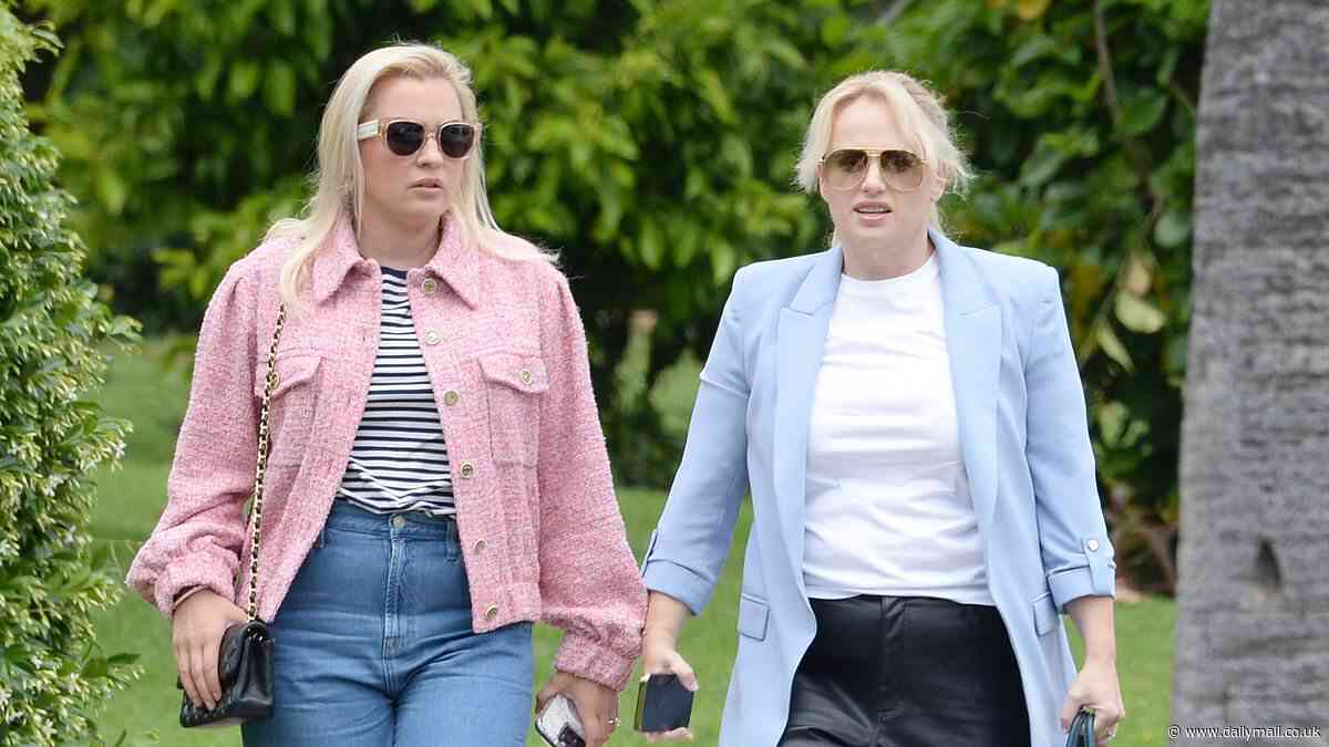 Rebel Wilson cuts a stylish figure as she flashes a smile while heading out for lunch with her fiancée Ramona Agruma at the Beverly Hills Hotel