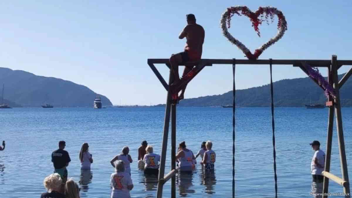 Moment British tourists wade into the sea and sprinkle loved-one's ashes into the water at his favourite holiday spot in Turkey... unwittingly horrifying locals and triggering health scare