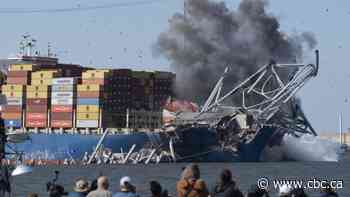 Preliminary report issued into Baltimore bridge collapse as crew languishes aboard ship