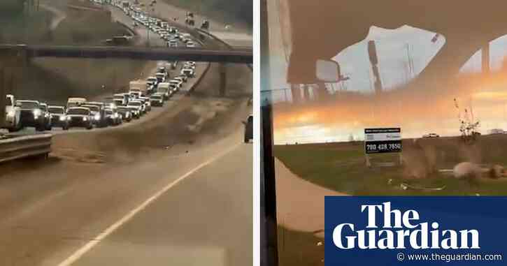 Canada wildfires: huge queues on highway as thousands evacuate oil town – video