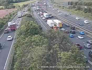 Queues forming on M6 outside Warrington after lorry sheds load
