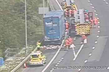 M60: Traffic stopped for fire close to Trafford Centre