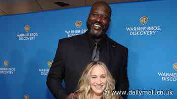 Shaquille O'Neal, 7ft1in, towers over Sarah Jessica Parker, 5ft3in, as the pair pose up at the star-studded Warner Bros Upfronts in NYC