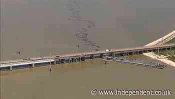 Barge slams into Galveston bridge causing collapse as oil spills into water below
