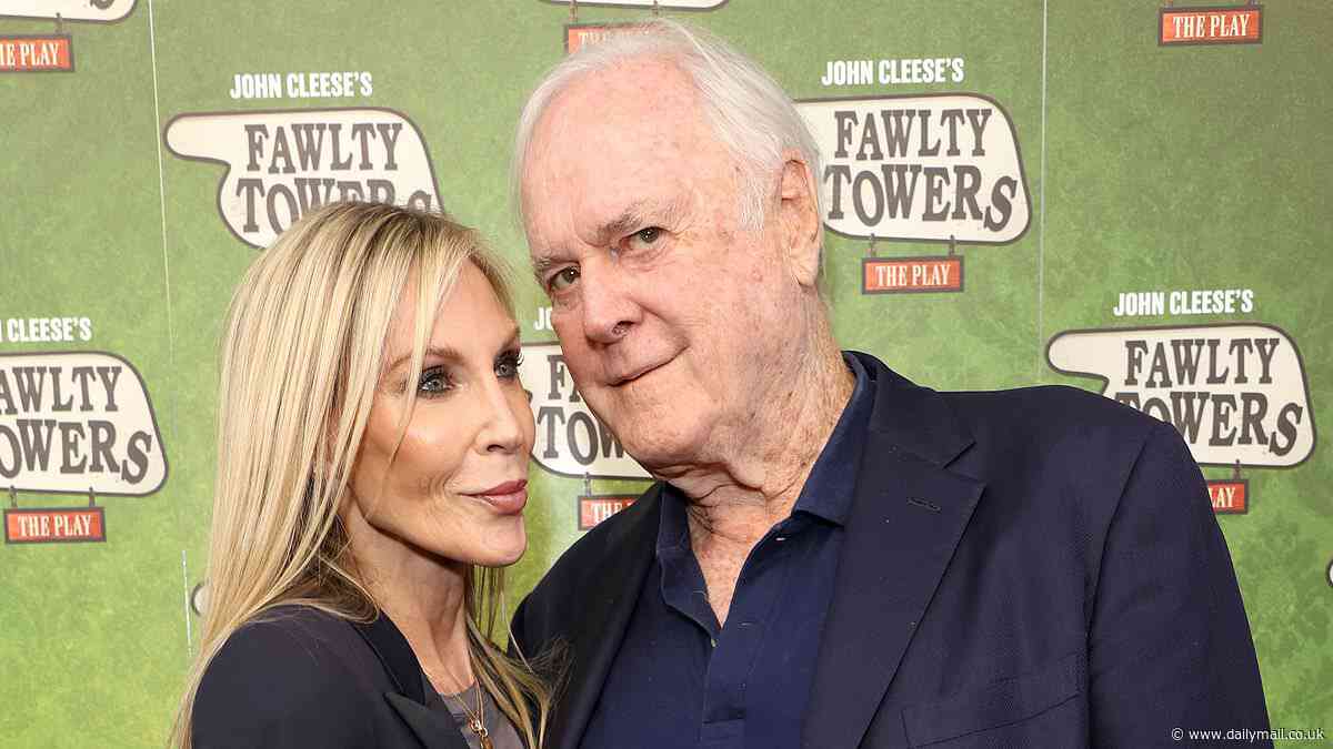 John Cleese, 84, cosies up to his fourth wife Jennifer Wade, 52, on the red carpet as he brings Fawlty Towers to the West End stage