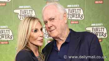 John Cleese, 84, cosies up to his fourth wife Jennifer Wade, 52, on the red carpet as he brings Fawlty Towers to the West End stage