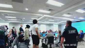 Police remove protesters for disrupting UNC Board of Trustees meeting