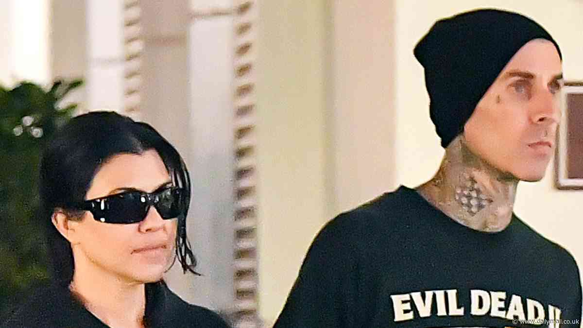 Kourtney Kardashian sweetly holds hands with husband Travis Barker on romantic stroll in Calabasas... as couple celebrate SECOND wedding anniversary