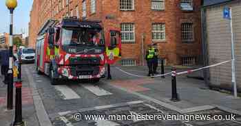 Fire crews cordon off Manchester street after blaze