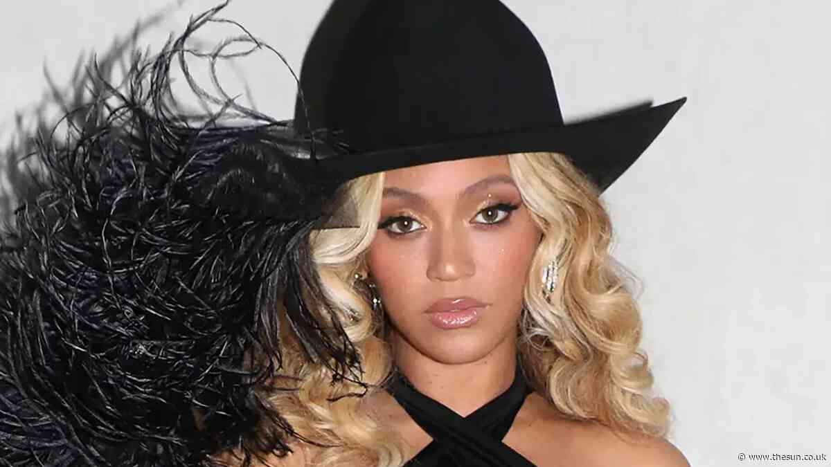Beyoncé looks stunning in sexy slashed black gown and rose heels