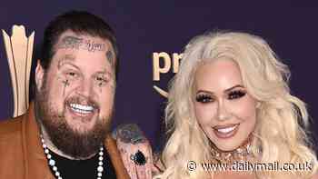 Jelly Roll shares a loving kiss with wife Bunnie Xo as they arrive at 2024 ACM Awards red carpet... as the nominated singer is set to perform
