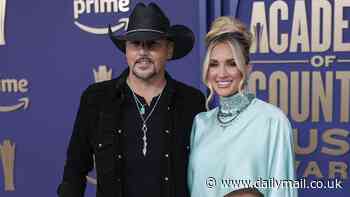 Jason Aldean, 47, plants a kiss on his glamorous wife Brittany, 35, as the duo hit the red carpet at the 2024 ACM Awards - before performing emotional Toby Keith tribute