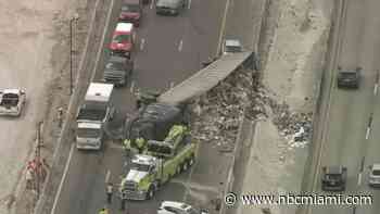 Rollover crash involving tractor-trailer snarls traffic on Sawgrass Expressway