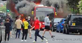Twickenham bus fire: Massive flames burst out of vehicle as sirens roar and firefighters battle blaze