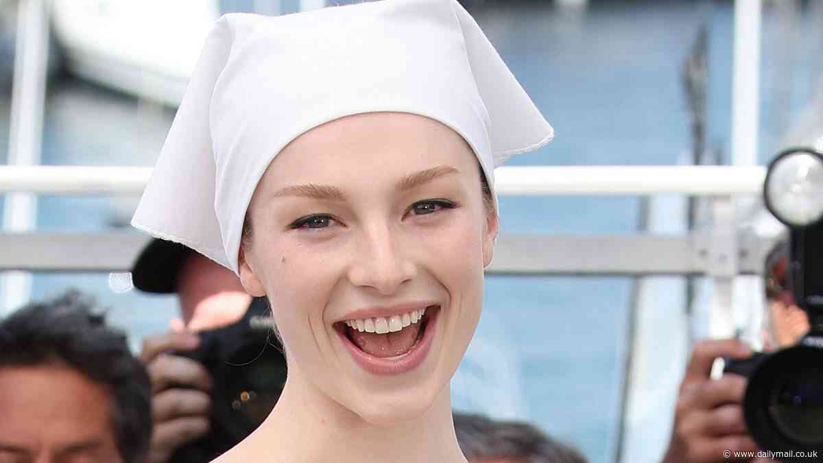 Cannes Film Festival: Hunter Schafer shows off her kooky sense of style in a frilled white mini dress and a matching bandana at the Kinds Of Kindness photocall