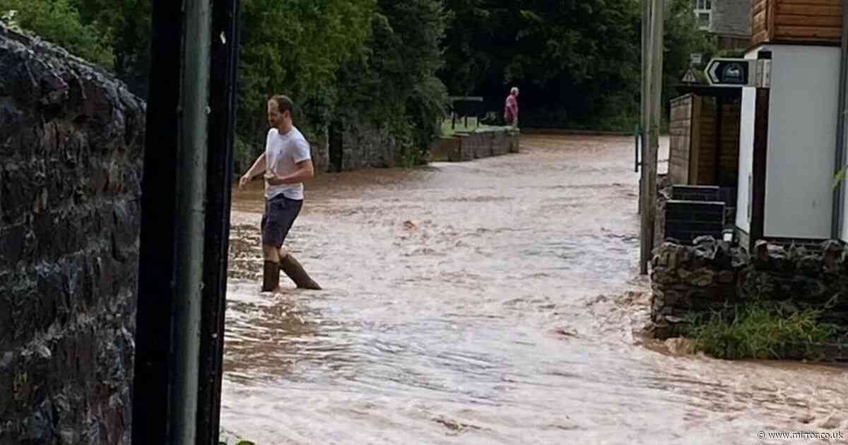 UK weather: Huge floods block roads after 'biblical' rainfall sees river burst its bank