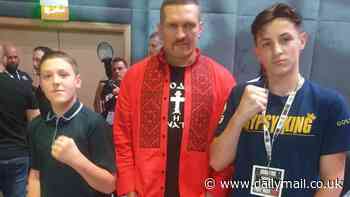 Tyson Fury's eldest son strikes a pose next to Oleksandr Usyk just hours before the Gypsy King's undisputed heavyweight title fight in Saudi Arabia
