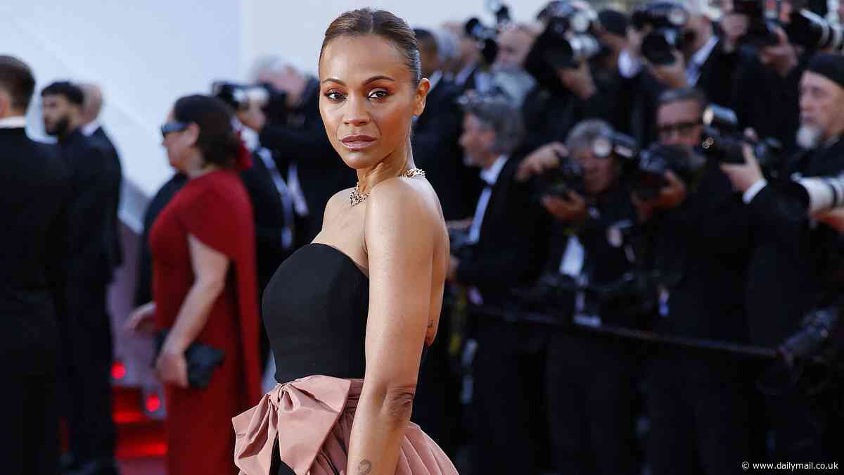 Zoe Saldana exudes glamour in a black and rose hued floor-length gown as she graces the red carpet at the Emilia Perez Cannes Film Festival premiere