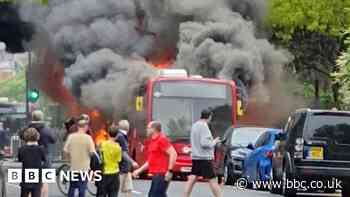 Smoke fills street as London bus catches fire