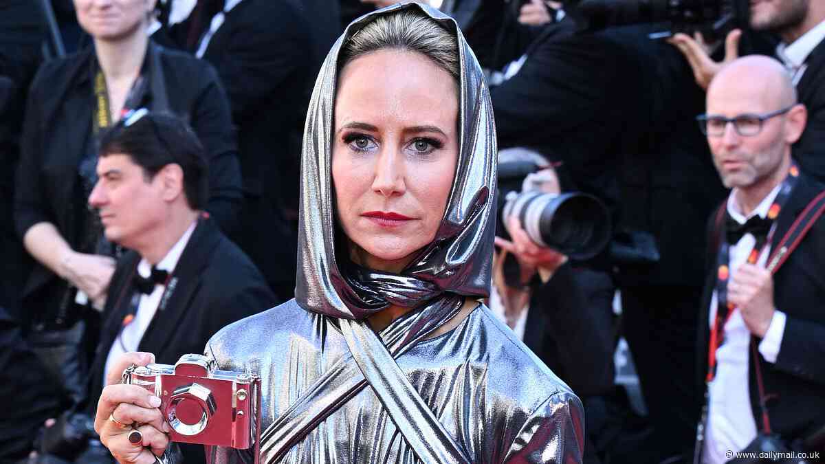 Lady Victoria Harvey puts on a quirky display in a metallic silver hooded dress as she attends the Emilia Perez premiere at the 77th Cannes Film Festival