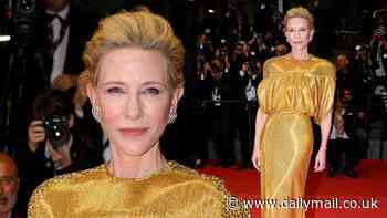 Golden girl! Cate Blanchett stuns in a puffy metallic gown as she attends Cannes Film Festival - before getting a four-minute standing ovation for new film Rumours